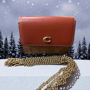 NWOT. Coach Brown Leather Mini Bag with original Coach gold chain.